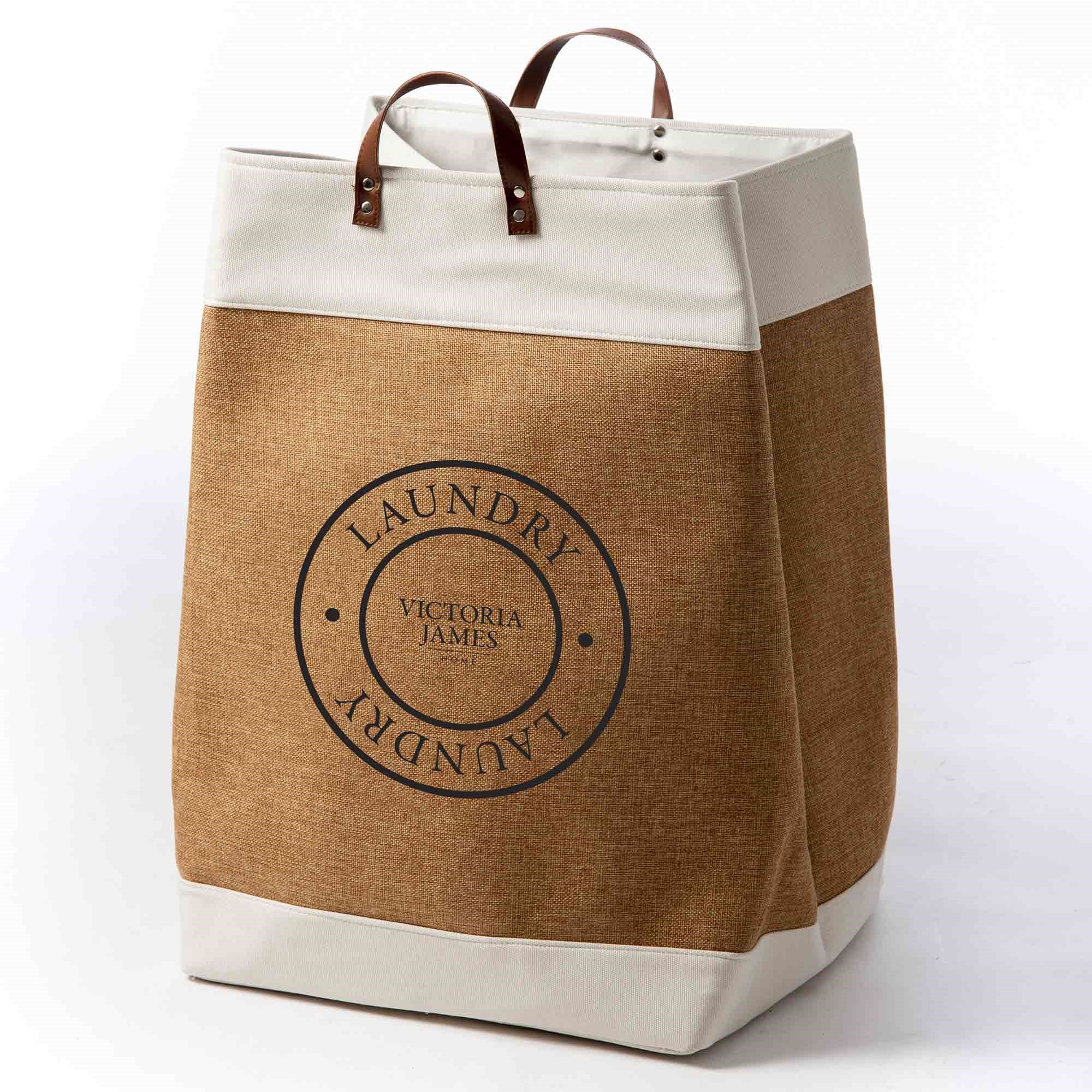 Brown and beige laundry bag with 'Victoria James' branding on a white background. Victoria James Home Laundry Hamper
