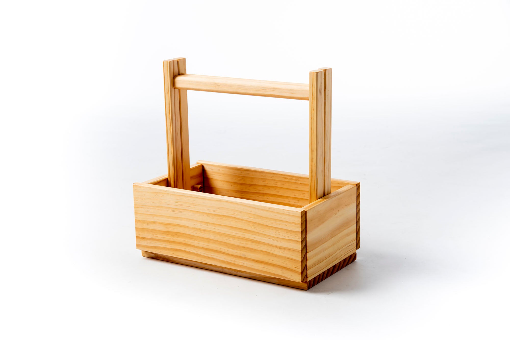 Wooden basket with a handle on a white background. Victoria James Home Storage Box VJA Convertible